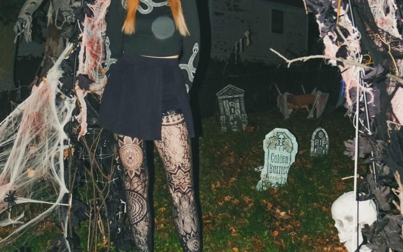Halloween enthusiast Jenaica Hunt stands in front of her decorations Oct. 22 in Webster. Hunt, a lifelong Webster resident, said this is her first year getting to decorate her own house for the holiday. Reporter &amp;amp; Farmer | Leyton Beardslee