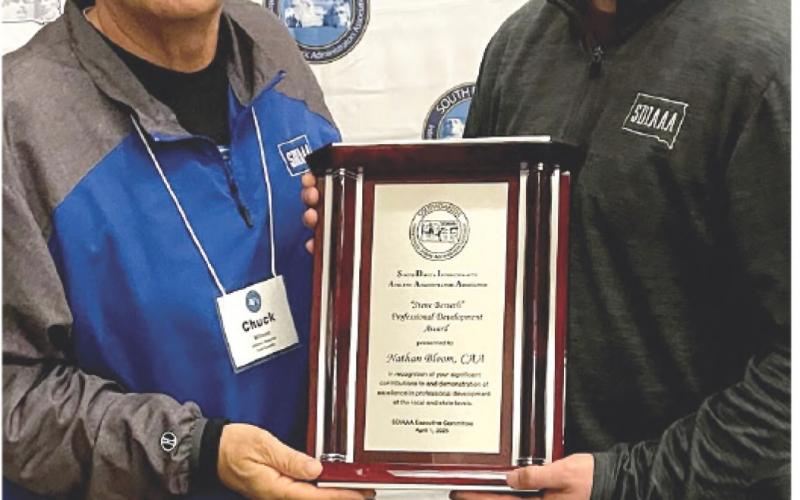 From left, Todd County AD Chuck Wilson, president of the SD Interscholastic Athletic Administrators Association presented the Steve Berseth professional development award to Webster Area School AD Nathan Bloom at SDIAAA's annual conference in Chamberlain. Reporter &amp;amp; Farmer \\ Subscriber snapshot