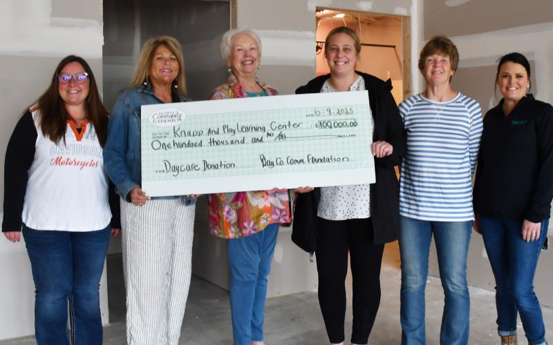 Day County Community Foundation members Amanda Dohn, Kim Sinner and Rita Johnson last week presented a $100,000 check donation to the Knapp &amp;amp; Play Learning Center group, represented here by Jenna Wik, Kathy Meland and Rainy Hanson. Reporter &amp;amp; Farmer | Annie Witt