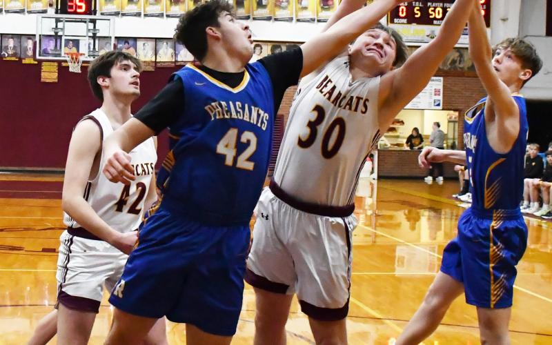 Webster Area Bearcats had their last home game of the season against Redfield and secured an 71-41 victory Feb. 22. Here, Thomas Kuecker (30) attempts to grab the rebound between Redfield’s Ethan Falk (42) and Isaac Banister (22) while Jack Shoemaker (42) rushes towards the paint. Reporter &amp;amp; Farmer | Brenner Cariveau