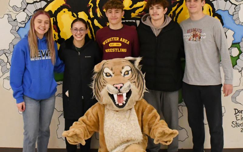 Webster Area wrestling program is sending five wrestlers to compete in the state tournament Feb. 27-March 1 in Rapid City. Here from left, Brooke Grajczyk, Jocelyn Rumpca, Tayten Kurkowski, Haeden Jorgenson and Gage Baumgarn stand behind the Bearcats’ mascot. Reporter &amp;amp; Farmer | Brenner Cariveau