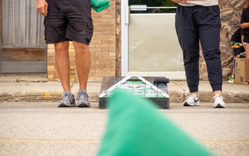 Corn hole players Paul Mogen of Casper, WY and Jocelyn Halma of Slayton, MN watch Mogen’s shot fall on the board during Waubay Fun Fest July 19. After a hard fought game Halma, who said she used to live in Waubay, emerged victorious. Reporter &amp; Farmer | Leyton Beardslee