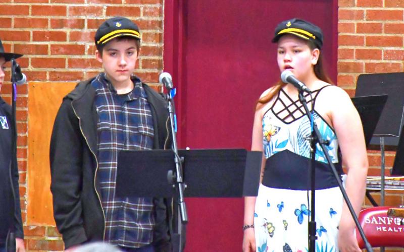 Webster Area Elementary put on their spring music concert April 20. The theme was based around western ideas and kids dressed up looking ready for the ranch life. From left, Oakley Ascher, Lucas Breaw and Piper Sichmeller introduce the next song. Reporter &amp;amp; Farmer | Connor Handrahan