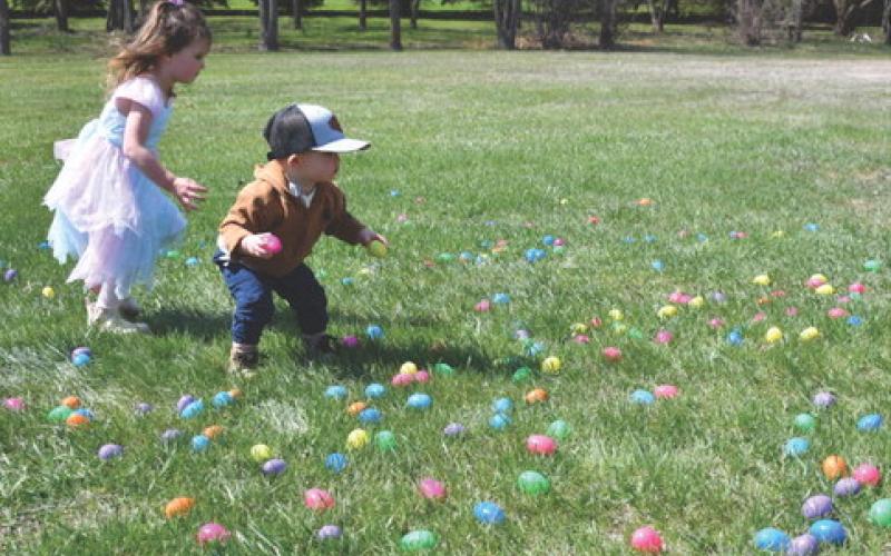 Chesney and Stone, son and daughter of Dani and James Pearson dash through a colorful spread of Easter eggs during the Easter Eggstravaganza hosted by First Baptist Church May 2. The event was postponed earlier in the year due to weather. Reporter &amp;amp; Farmer | Jessica Washenberger