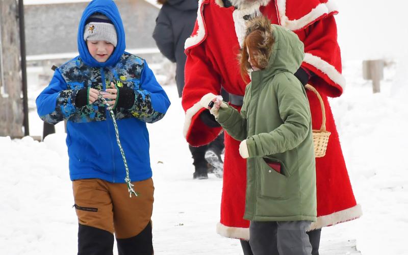 Santa visited Fort Sisseton Historical State Park distributing candy to children during the Frontier Christmas celebration Dec. 14. Here, from left 12-year-old Elias Lindner and 10 year-old Eliana Linder from Watertown walk away after Santa handed out candy to them. Elias and Eliana are the children of Dana and Jamie Lindner. Reporter &amp;amp; Farmer | Brenner Cariveau