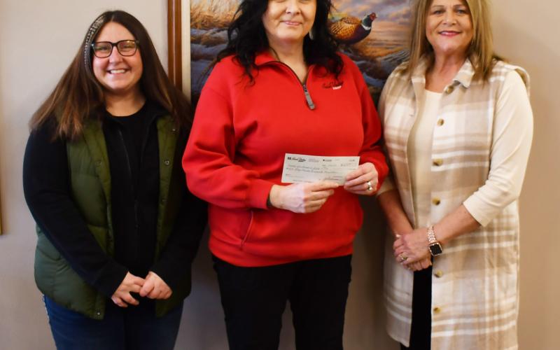 As a part of their December 12 days of giving event which gives back 12 percent of profits to the community, Sioux Valley Coop donated $2,650 to the Day County Community Foundation. The check with the donation was handed to the foundation Feb. 19. Here from left, DCCF member Amanda Dohn stands next to Sioux Valley Coop General Manager Cheryl Premus and fellow DCCF board member Kim Sinner. Reporter &amp;amp; Farmer | Brenner Cariveau