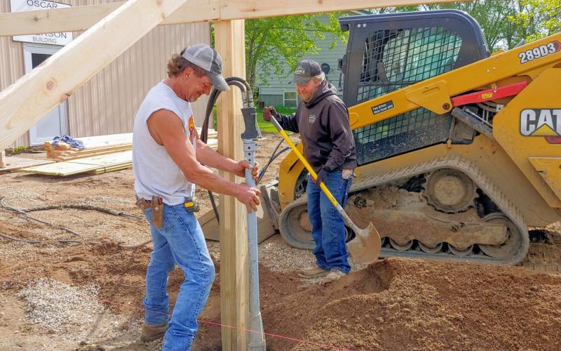 Rock is stamped around posts May 28 as construction begins for an addition to the Museum of Wildlife, Science &amp;amp; Industry in Webster. Pictured from left are Chris Amundson and Greg Johnson. Reporter &amp;amp; Farmer | subscriber snapshot