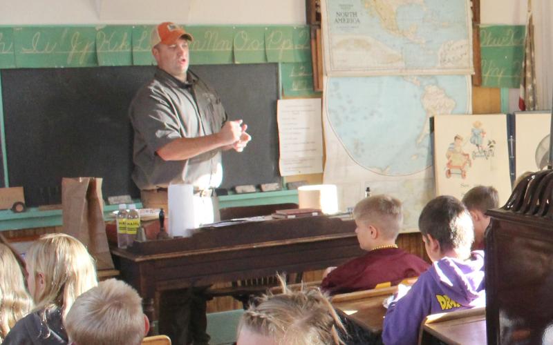 Calvin Meyer of SD Game, Fish &amp;amp; Parks led Webster Area fourth graders in creating pollinator balls of clay and seeds. Reporter &amp;amp; Farmer | Subscriber snapshot