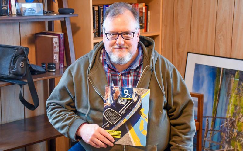 Greg Abbott of Lily, pictured in his home Dec. 10 is the chief editor of the Saab Club of North America’s quarterly magazine. Abbott said he purchased his first of many Saab cars while in college and has been involved with the club since 2006. Reporter &amp;amp; Farmer | Leyton Beardslee