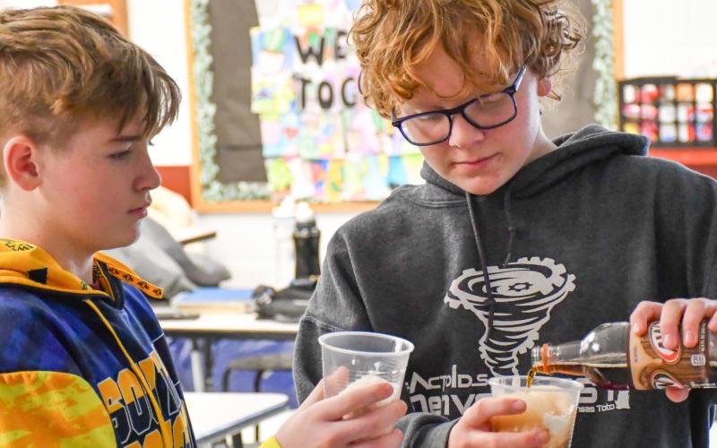 Webster Area eighth grade students, from left, Harley Valley and Casen Fish make root beer floats Feb. 2 at Webster Area Middle School as the class reward for having the highest average attendance for the month of January. Principal Craig Case said this is one change the school has made to help incentivize higher attendance among elementary and middle school students. Reporter &amp;amp; Farmer | Leyton Beardslee