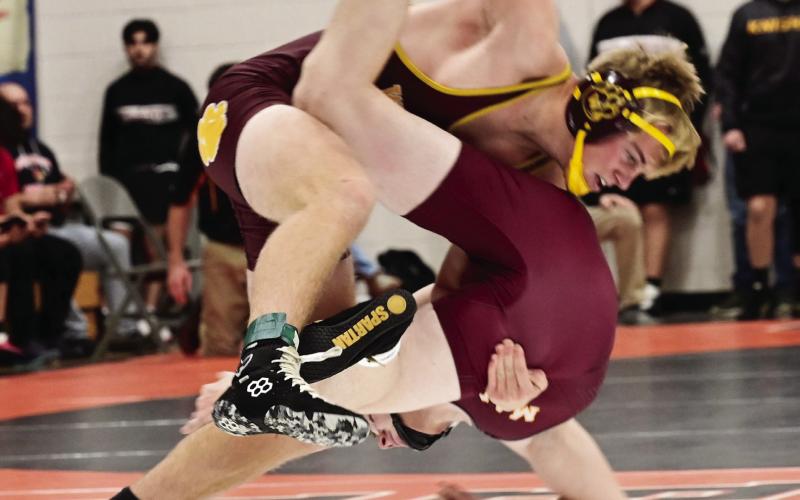Webster Area wrestlers competed at the Ken Ruml Invitational Dec. 14 in Howard. Here, Webster Area wrestler Gage Baumgarn slams his opponent down to the mat. Reporter &amp;amp; Farmer | Dax Jorgenson