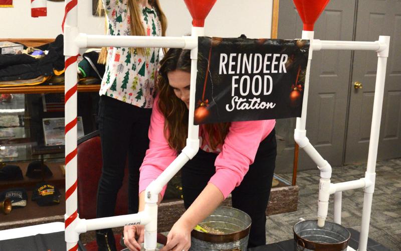 Among the carnival games featured at Waubay Santa Day, the Reindeer Food Station sponsored by Avera featured Aunicka Dargatz and her mother Stephanie Dargatz packing the reindeer food. These magical reindeer food packs come with instructions so the kids know exactly when to sprinkle it out as a special treat for Santa’s reindeer. Reporter &amp;amp; Farmer | Jessica Washenberger