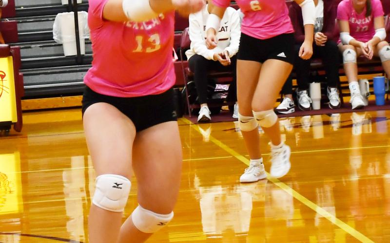 Webster Area Bearcats hosted Tiospa Zina Wamdbi at the armory Oct. 8. The Bearcats won the match in three sets. Here, Katie Braun (13) tracks down the ball and hits it towards her teammates while Allison Case (6) prepares to make a play. Reporter &amp;amp; Farmer | Brenner Cariveau