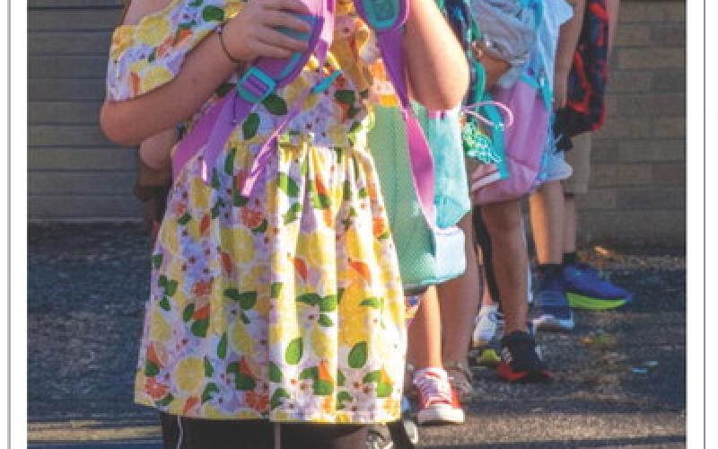 Alena Carlson, age five, daughter of Justin Carlson and Abbie Carlson of Webster lines up for her first day of school at Webster Area Elementary School Aug. 19. Reporter &amp;amp; Farmer | Leyton Beardslee