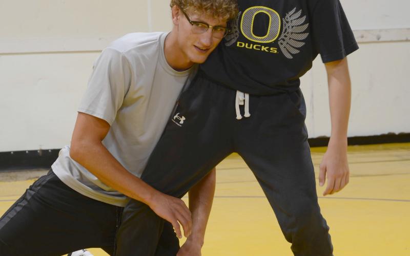 Webster Area 2022 graduate Cael Larson demonstrates a move on incoming Webster Area eighth grader Vance Tollifson. Webster Area Wrestling Booster Club hosted the camp for wrestlers sixth grade and under, Thursday July 24 at the wrestling room. Following the camp a summer party took place at Webster Aquatic Center. Reporter &amp;amp; Farmer | Annie Witt