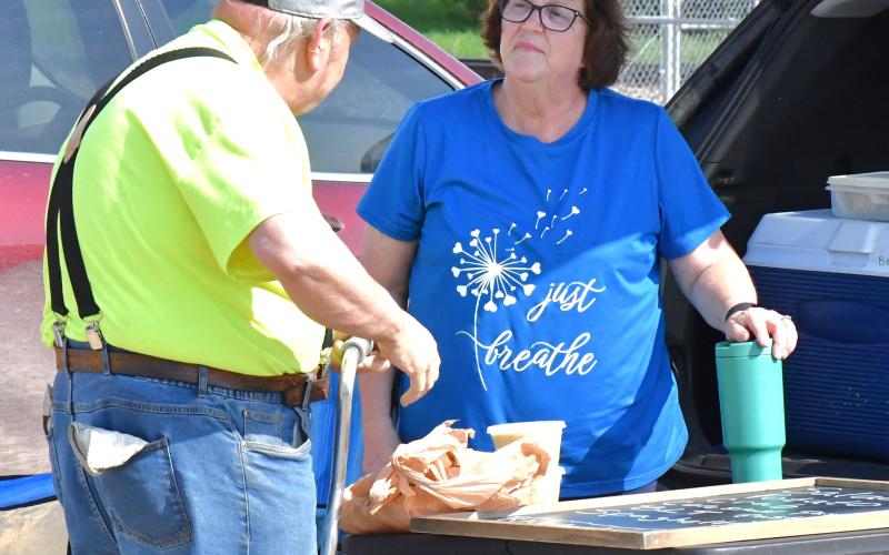 The first day of Webster’s farmers market was June 2 and people were set up and ready to sell their creations. Here, Danny Johnson buys salads from Betty Schmidt. “It is the world’s best salads,” said Johnson. Reporter &amp;amp; Farmer | Connor Handrahan