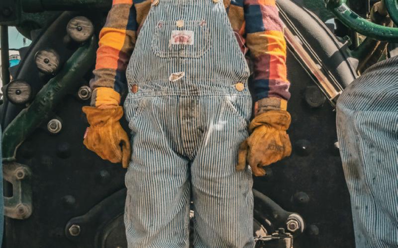 Abram Edin, age four, son of Colt and Stacey Edin from Esko, MN waits for the parade to start on the back of a steam powered tractor Sept. 6 at the James Valley Threshing Show in Andover. Reporter &amp;amp; Farmer | Leyton Beardslee