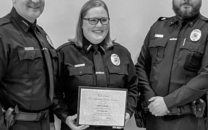 Bobbi Ann Mitchell, pictured center, celebrated the completion of law enforcement school May 2 from Bismarck, ND. She is pictured with Chief Troy White Owl and Sargent Demetrius Jamerson. Mitchell is set to begin working for the city of New Town, ND after completing the 12-week course to become a certified law enforcement officer. She is the daughter of Patti Mitchell of Grenville Reporter &amp;amp; Farmer | Subscriber snapshot