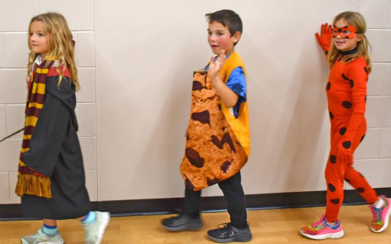 Ahead of trick-or-treating Oct. 31, Webster Area Elementary students held a parade to show off their Halloween costumes. Pictured here are students Anna Bloom, Tyler Acree and Naomi Acree. Reporter &amp;amp; Farmer | Jessica Washenberger