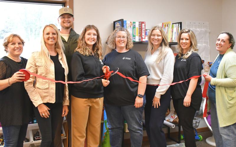 Ribbon is cut for the grand opening of Rising Hope Counseling location in Webster. From left is Rising Hope director of operations Twyla Eggers, founder Jill Janecke, counselor Amanda Kirkeby and Webster Area Chamber of Commerce members Amy Fischer, Lindsey Olson, Bailey Meyer and Alisha LaCourse. In back is Kirkeby’s husband Brody. Reporter &amp;amp; Farmer | Leyton Beardslee