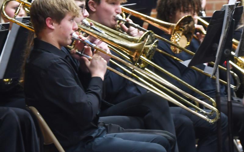 Webster Area Middle School and High School students performed in the winter conert Dec. 5 at the Webster Armory. Here, high school band members in line Michael Dorsett, Lukas Johnson, Thomas Kuecker and Mason Huwe play the trombone as a part of the concert. Reporter &amp;amp; Farmer | Brenner Cariveau