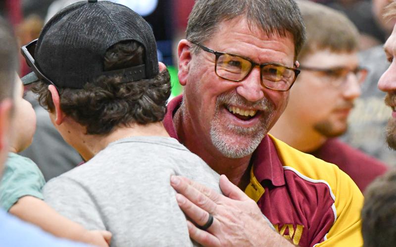 Webster Area head wrestling coach Wade Rausch is congratulated by former wrestlers after being selected as Region 1 coach of the year at SDHSAA Region 1B wrestling tournament in Webster Feb. 21. Rausch has announced his retirement at the end of the school year with his final wrestling meet being the SDHSAA State Wrestling Championship in Sioux Falls Feb. 26-28. Reporter &amp;amp; Farmer | Leyton Beardslee