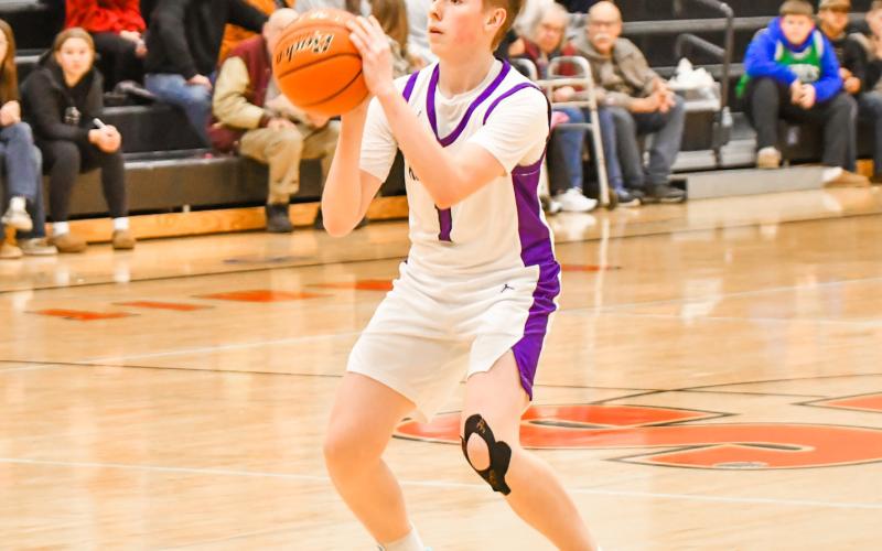 Jace Wohlleber of Waubay/Summit Mustangs puts up a three during the team’s 56-24 victory over Tri-State Tigers Dec. 30 in Summit. Wohlleber scored 12 points with all of them coming from three-pointers. Reporter &amp;amp; Farmer | Leyton Beardslee