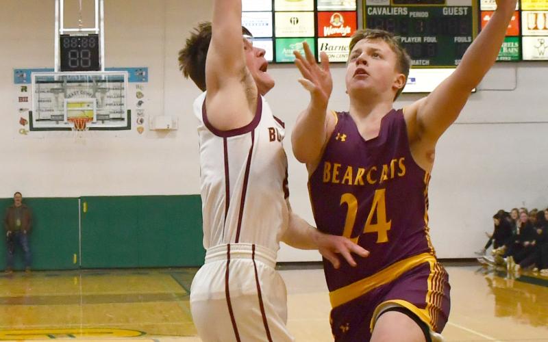 Webster Area boys basketball faced Milbank in Aberdeen March 4 in the first round match of the Region 1A bracket. Bearcats went on to lose the contest 20-54. Here, McKoy Pereboom (24) drives to the basket while Milbank defender Bryan Meyer (4) attempts to block the shot. Reporter &amp;amp; Farmer | Brenner Cariveau