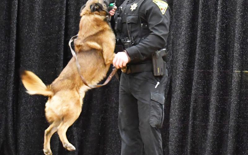 2025 Webster Area Farm and Home Show was at the Webster Armory Jan. 24-25. A dog demonstration by South Dakota Highway Patrol Jan. 24 displayed some skills the dogs use to locate the scents of narcotics. Here, Trooper Nathan Monger braces as his dog Dax jumps up on him after he found the narcotic scented prop for the demonstration. Reporter &amp;amp; Farmer | Brenner Cariveau