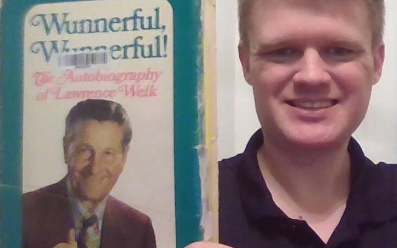 Scott Wheeler of Tallahassee, FL holds up a copy of Lawrence Welk’s autobiography Wunnerful, Wunnerful! Since January, Wheeler has been gaining letters of support for his mission to receive a symbolic resolution from congress to honor Welk and the cast of the show which featured accordionist Myron Floren from Roslyn. Reporter &amp;amp; Farmer | subscriber snapshot