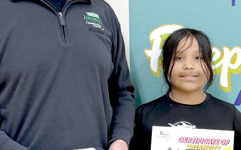 Webster Area School student Lydia Williams, right, was chosen water bottle label design contest winner by Lake Region Electric (LRE). This was the first year that LRE did a water bottle label contest. In the past, they have donated bottled water to the school to use at events and fundraising opportunities. This year they involved third grade students to help educate about electrical safety. Reporter &amp;amp; Farmer | Subscriber snapshot