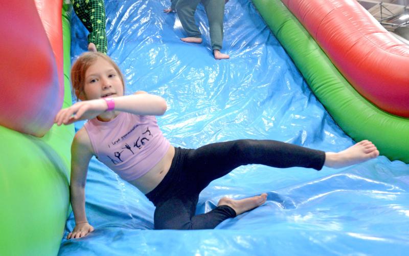 Nine-year-old Olivia Ewing bounces on one of the inflatable game areas that was at the Shake Your Shamrock event at the Webster Armory March 15. The event was used as a fundraiser for the Webster-Dewangen student exchange group. Ewing is the daughter of Corey and Ashley Ewing, Webster. Reporter &amp;amp; Farmer | Amanda Dulitz