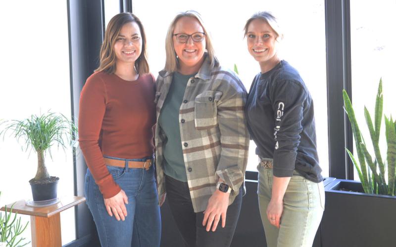 The Flower Cart LLC is a full service floral shop which ensures all of your needs will be met. Located at 501 Main St. the Flower Cart provides exceptional customer service and strives for customer satisfaction. Here, from left are Sarah Miller, owner Leslie Hendrickson and Ashley Fuss.