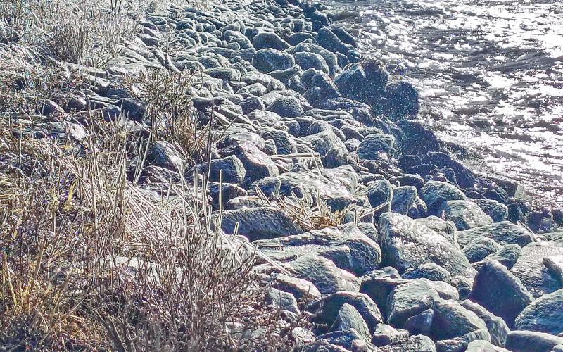Strong south winds churn the waters along the south side of the U.S. Hwy. 12 Rush Lake grade west of Waubay March 28, sending waves crashing into the rocky shoreline and coating nearby riprap and grass in a layer of ice. Reporter &amp;amp; Farmer | Jessica Washenberger