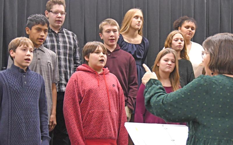 Members of the Waubay Middle School chorus performed Dec. 9 for their Christmas concert. Pictured from left in back are, Tyson Utne, Elise Aker and Kaliesha Neilan; middle row, Victor Vermillion, Conner Butler and Riley Pies; in front are Kellin Boik, Ayden Eagle and Rynsey Jorgenson. The performers were directed by Jill Beers, pictured at bottom right. Reporter &amp;amp; Farmer | Amanda Dulitz