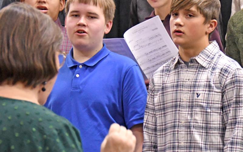 High School choir members performed Christmas tunes Dec. 9 during Waubay School’s seasonal concert. Choir members pictured from left are Parker Vermillion, Roman Thuringer, Linken Niles and Bo Berger. In bottom left is director Jill Beers. Reporter &amp;amp; Farmer | Amanda Dulitz