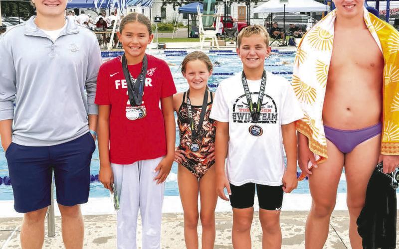 Webster swimmers qualified to swim in the State A swim meet July 18-20. From left are coach Thomas Kuecker, 400 freestyle State A champion Keisha Rencountre, Libby Huggett, Landen Lee and McKoy Pereboom. Reporter &amp;amp; Farmer | Subscriber snaphot