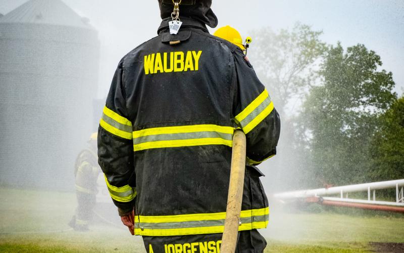 Alex Jorgenson of Waubay Fire Department helps hold the hose for his team during the fire department water fight at Waubay Fun Fest July 19. Waubay was victorious in each of their matches and won the competition. Reporter &amp; Farmer | Leyton Beardslee