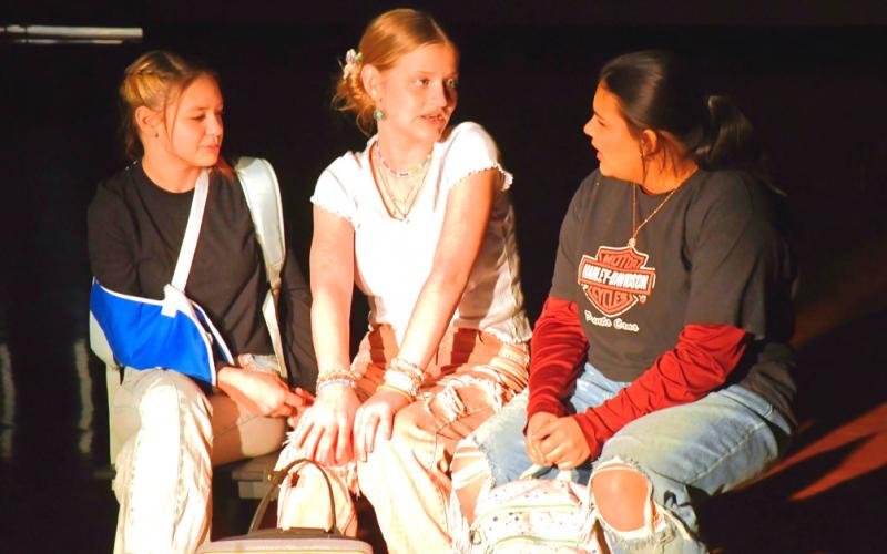 Taylee Cyrus, left, and Kloey Garrett, middle, play the parts of characters welcoming welcoming the new girl,played by Ava Huggett, right, in Webster Area School’s one act play Bus Stop Jan. 25. In the show, Huggett’s character just started at this school due to issues at home and is fighting mental battles. Cyrus’ and Garrett’s characters have to decide if their duo of fun can include another. Reporter &amp;amp; Farmer | Connor Handrahan