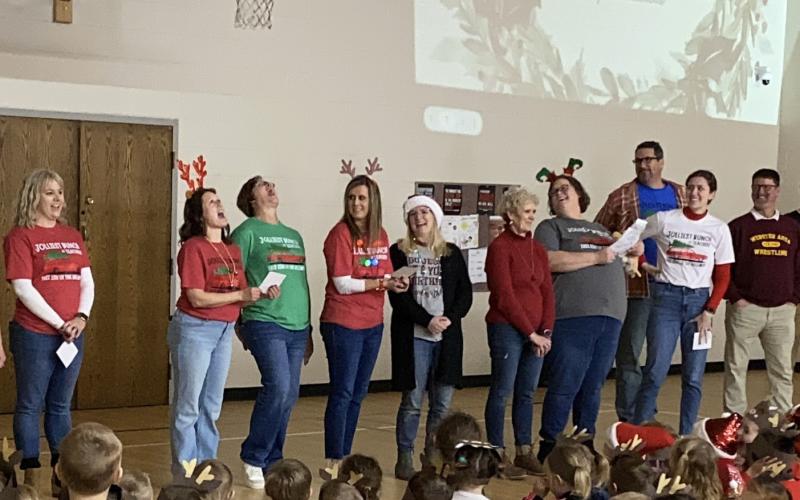 Webster Area Elementary School staff and students took part in a Christmas sing along in the elementary school gym Dec. 20. Staff, from left, leading the singing of The 12 Days of Christmas are Vanessa Bloom, Robin Dorsett, Jennifer Witt, Ashley Hanson, Christine Keller, Nancy Block, Heather Kwasniewski, Jared Vergeldt, Emily Wagner and Wade Rausch.