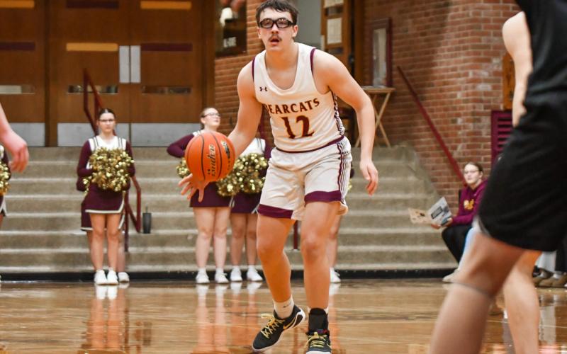 Jeron McCreary (12) of Webster Area looks for an opening during the Bearcats 73-53 win over Waverly-South Shore Coyotes Jan. 27 in Webster. McCreary aided in the victory with a nine point performance. Reporter &amp;amp; Farmer | Leyton Beardslee