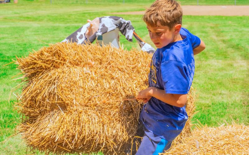 Jackson Sandal hoists a straw bale during the fittest farmer contest at Eden Days June 28. He competed with his mother Jennifer Sandal both of Eden. See more photos throughout. Reporter &amp;amp; Farmer | Leyton Beardslee