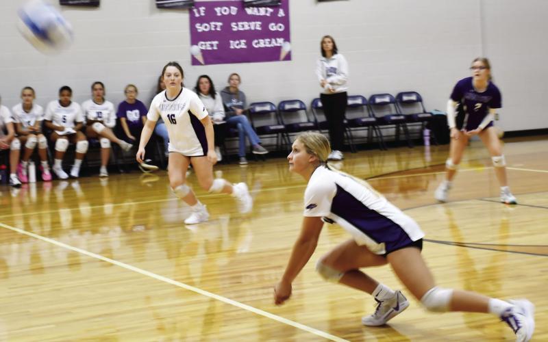Waubay-Summit Mustangs closed out their regular season as they hosted Webster Area Bearcats Oct. 29. The Mustangs fell in three sets to the Bearcats. Here, Kayce Berger (14) dives for the ball while her teammates JoZee Snyder (16) and Brianna Lindholm (2) watch closely preparing to make a play on the ball. Reporter &amp;amp; Farmer | Brenner Cariveau