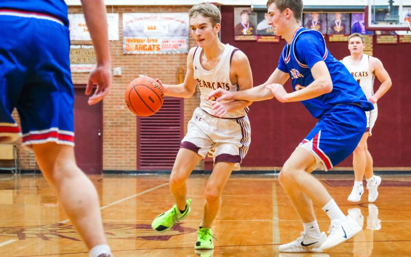 Seth Lesnar of Webster Area takes the ball up the court during the Bearcats 42-64 loss to Warner Monarchs Dec. 13 in Webster. Lesnar finished with a team high 16 points and also grabbed five rebounds. Reporter &amp;amp; Farmer | Leyton Beardslee