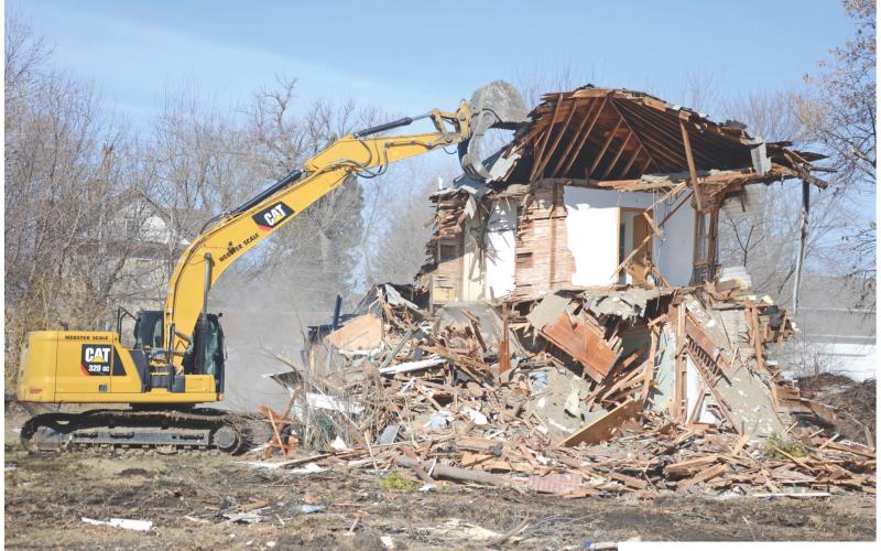 A house and garage at 909 E. 1st Street in Webster was demolished April 8. Webster City Council approved the removal poration, which included allowing the debris from the structures to be hauled to the city dump for disposal. permit request by Webster Area Development Cor- Reporter &amp;amp; Farmer \\ Amanda Dulitz
