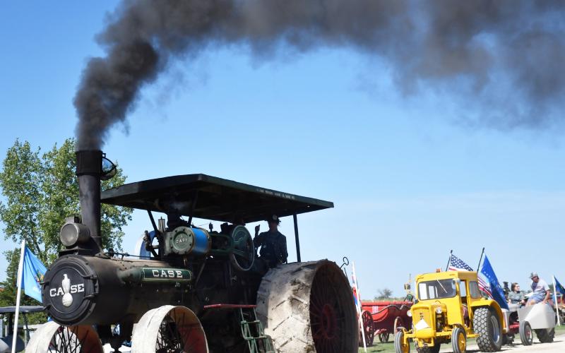 In Andover Sept. 6-8 the James Valley Threshing Show celebrated its 50th anniversary. On Sept. 7, the parade saw a wide range of antique vehicles ranging from trucks, cars and vintage tractors. Here, an antique Case tractor rolls coal to create a dramatic effect for the parade viewers. Reporter &amp;amp; Farmer | Brenner Cariveau