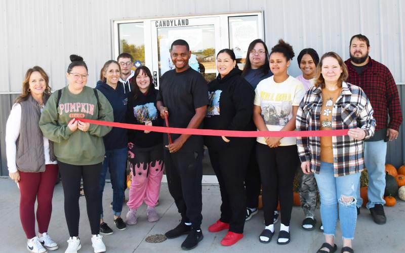 Candyland Smoke Shop officially cut the ribbon for their business Oct. 4. Present at the ribbon cutting were Candyland staff and members from Webster Area Chamber of Commerce. Pictured from left, Kathy Kwasniewski, Tammy Eidahl, Jami Hubsch, Kaylob Alston, Megan Traylor, Jessie Scott Sr., Bridgette Neilan, Roberta Neilan, Kailesha Neilan, Casharie Neilan, Julie Spiering and Curtis Neilan.
