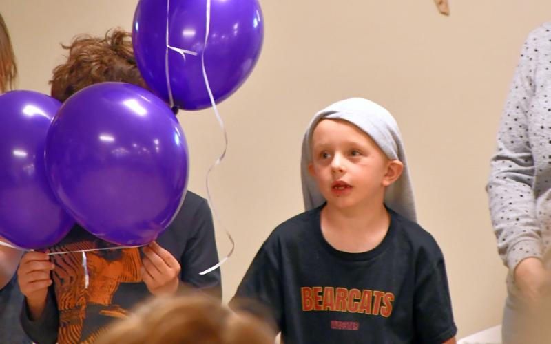Kohenn Konradi recites the Rosary as part of a balloon Rosary ceremony at Christ the King Parish Center in Webster April 30. Reporter &amp;amp; Farmer | Leyton Beardslee