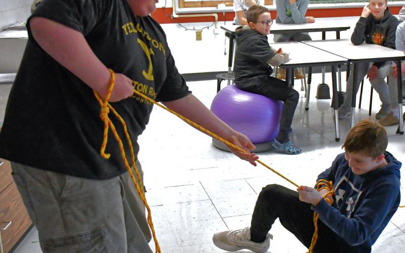 Webster Area School hosted a fishing lesson for third to seventh grade students Feb. 26 taught by Neenah High School in Wisconsin. In this class, students were taught the importance of ice safety. Front left, Tristan Powell and Cruz Shafer practice their rope rescuing. In back left, Tucker Aadland, Brasen Breske, Kannon Kwasniewski, Gunnar Lesnar watch the demonstration. Reporter &amp;amp; Farmer | Connor Handrahan