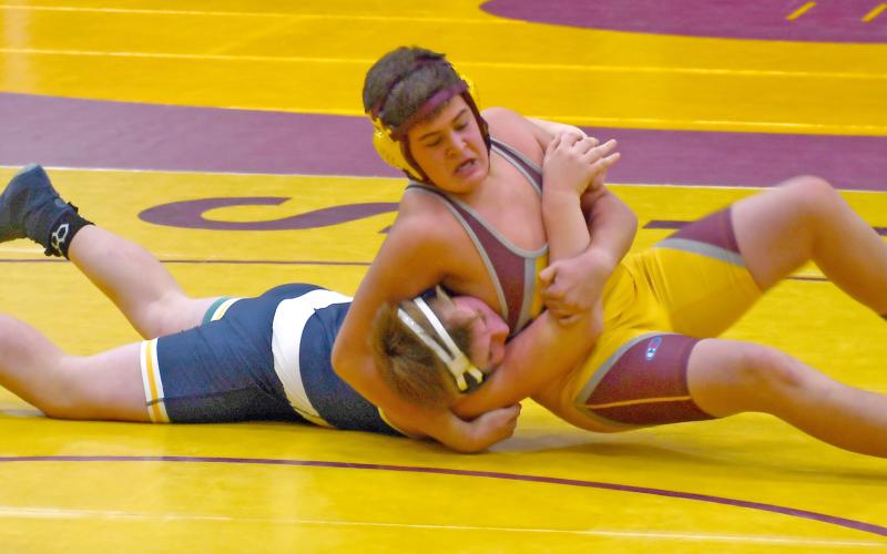 Webster Area boys wrestling team competed at the Webster Holiday Tournament Jan. 4 at the armory. Here, Webster wrestler Lennox Rumpca attempts to reposition as he has his opponent in a headlock. Reporter &amp;amp; Farmer | Brenner Cariveau